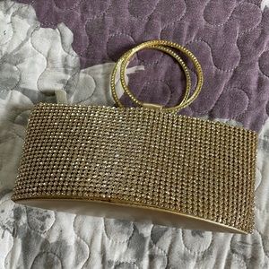 Gold crystal studded clutch